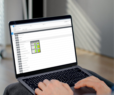 Laptop View of Reporting Portal Person reviewing their reporting options in their custom Shopper Confidential portal on their laptop.
